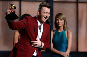 Sam Smith receiving New Artist of the Year Award from artist Taylor Swift.