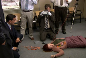 Michael distracts his employees with an over the top murder mystery game.