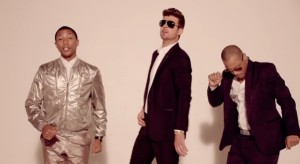 Pharrell Williams, Robin Thicke and T.I. in their "Blurred Lines" music video.