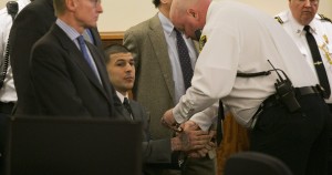 Hernandez being Handcuffed after being charged with first degree murder 