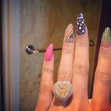 Nick Minaj is sporting an estimated 15-carat yellow heart-shaped engagement ring.