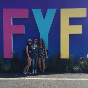 Attendees posing in front of FYF sign